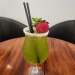 DAY ON THE GREEN - Midori, Pineapple Juice, Malibu, Parfait Amour